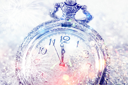 New Year's at midnight - Old clock with stars snowflakes and holiday lightsの写真素材
