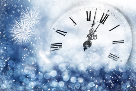 New Year's at midnight - Old clock with stars snowflakes and holiday lightsの写真素材