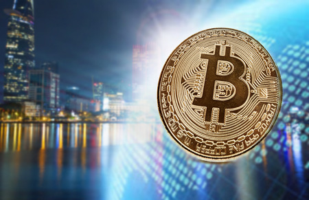 Golden bitcoin agains skyscrapers - futuristic smart city - cryptocurrency concept