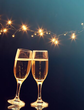 Champagne glasses on sparkling holiday background - Celebrating the New Yearの写真素材