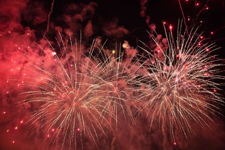 Magic golden holiday abstract background of sparkling fireworks. Christmas and New Year concept.の写真素材