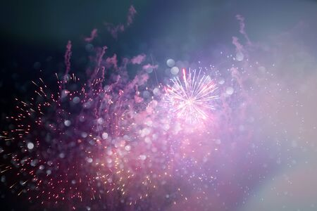 Magic golden holiday abstract background of sparkling fireworks. Christmas and New Year concept.