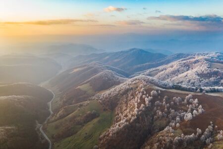 Aerial view of idyllic winter landscape with frozen trees in Transylvania. Winter is coming concept.の写真素材