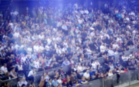 Blurred background of crowd of people in a basketball courtの写真素材