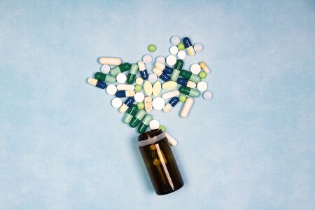Close up on a group of drugs or medicines and bottle. Medical and health care concept.の写真素材