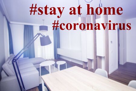 Staying at home with self quarantine to help slow outbreak and protect coronavirus spread.Appartment interior with stay at home text.の写真素材