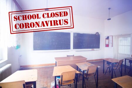 COVID-19 - Coronavirus pandemic - 2019-nCoV concept. Empty classroom with a the text of Closed school. Many countries orders closure of all schools and universities due to coronavirus outbreak.の写真素材