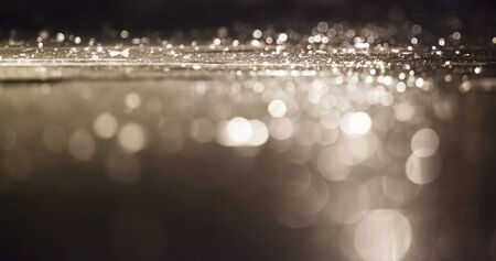 Magic holiday background of golden abstract bokehの写真素材