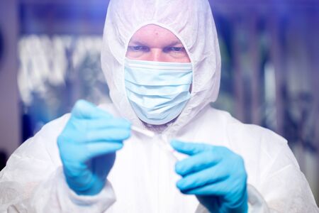 Concept of COVID-19 - Coronavirus disease - 2019-nCoV. Doctor holding blood sample for analysis and sampling of Covid-19 infectious disea.の写真素材