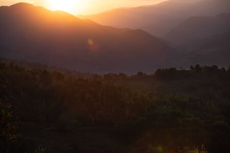 Beautiful sunset over summer hills.