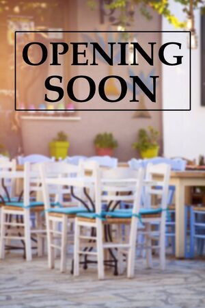 Opening soon sign on a restaurant. Coffee shops and resturants reopening after coronavirus pandemic.の写真素材