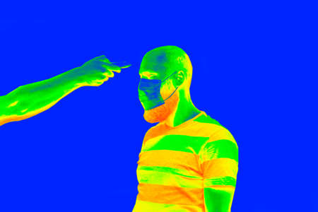 Thermal scanner detecting infected people with Covid-19. Coronavirus spread control concept.