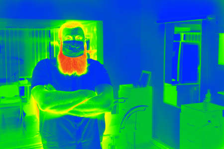 Thermal scanner detecting infected people with Covid-19. Coronavirus spread control concept.の写真素材