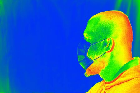 Thermal scanner detecting infected people with Covid-19. Coronavirus spread control concept.の写真素材