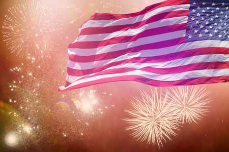 Celebrating Independence Day. United States of America USA flag with fireworks background for 4th of Julyの写真素材