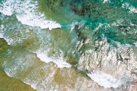 Aerial view of tropical sandy beach and blue ocean with crystal clear turqouise water. Abstract summer background.の写真素材