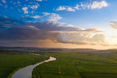 Sunset, aerial, atmospheric view on curving river Somesul in Transylvani, Romania. Beautiful romanian countryside-drone view.の写真素材