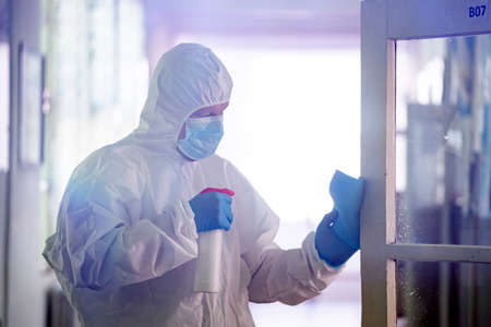 Worker sprays disinfectant as part of preventive measures against the spread of the COVID-19, the...