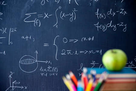 Back to School Concept. Accessories and books against chalkboard.の写真素材