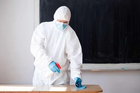 Worker sprays disinfectant as part of preventive measures against the spread of the COVID-19, the...