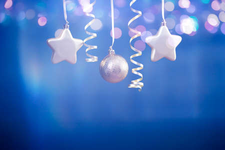 Holiday background with golden christmas decorations and magic holiday light.