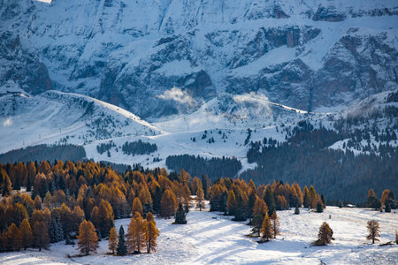 Small cottage in magic sunset in Dolomite mountains, Alpe di Siusi, Italy in winterの写真素材