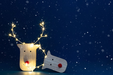 Reindeers in sparkling Christmas light - holiday backgroundの写真素材