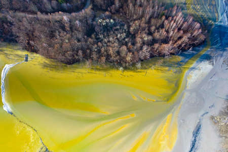 Beautiful aerial pattern of colorful water and mud, shot with a drone located at Geamana, Romania, a formerly village that was covered with toxic waste from a mining operation nearby.の写真素材