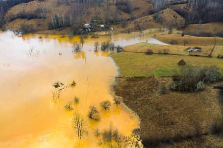 Beautiful aerial pattern of colorful water and mud, shot with a drone located at Geamana, Romania, a formerly village that was covered with toxic waste from a mining operation nearby.の写真素材