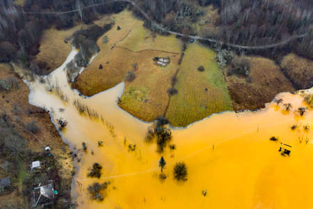 Beautiful aerial pattern of colorful water and mud, shot with a drone located at Geamana, Romania, a formerly village that was covered with toxic waste from a mining operation nearby.の写真素材