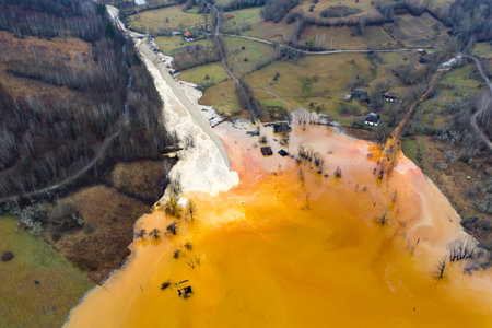 Beautiful aerial pattern of colorful water and mud, shot with a drone located at Geamana, Romania, a formerly village that was covered with toxic waste from a mining operation nearby.の写真素材