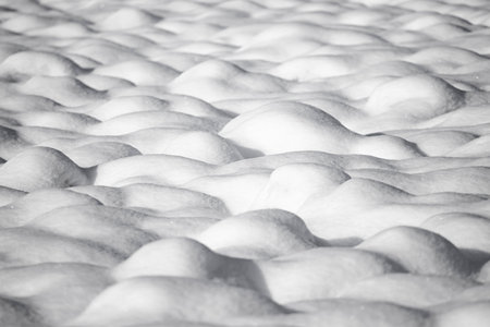 Natural winter background with snow drifts. Abstract shapes and snow texture.の写真素材