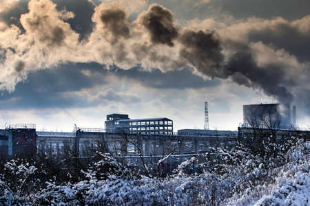 Air pollution from power plant chimneys.