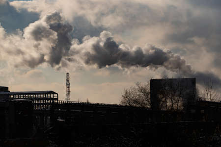 Air pollution from power plant chimneys.