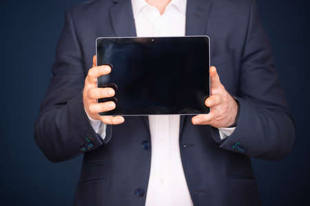 Business man using modern digital tablet. Concept of networking or social connection. Global...