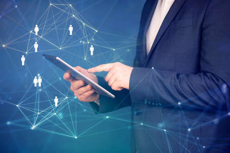 Business man using modern digital tablet. Concept of networking or social connection. Global...