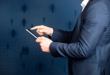 Business man using modern digital tablet. Concept of networking or social connection. Global...