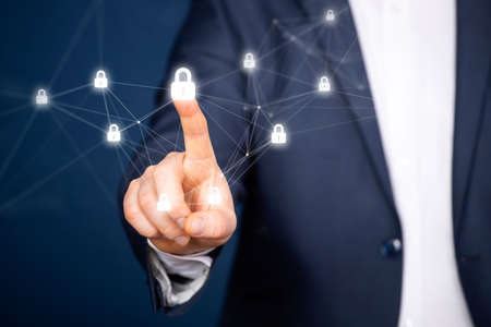 Businessman hand touching virtual screen. Cybersecurity and information technology security services...