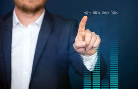 Financial statistics analysis and financial profit growth concept. Businessman writing, drawing on the screen.の写真素材