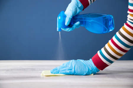 Sanitize surfaces prevention in hospitals and public spaces. Surface home cleaning spraying...