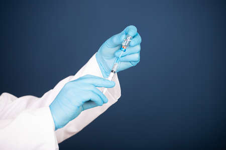 Concept of herd immunity, virus spreading in society. Banner of doctor with syringe is preparing for...