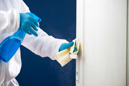 Disinfection, cleaning and washing of door handles. Prevention of coronavirus infectionの写真素材