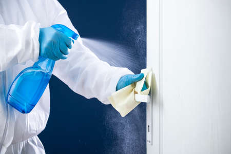 Disinfection, cleaning and washing of door handles. Prevention of coronavirus infectionの写真素材