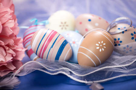 Happy Easter. Congratulatory easter background. Easter eggs and flowers.