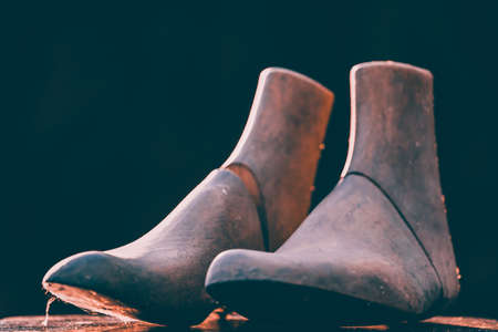 Vintage wooden mannequin foot - retro styled fashion backgroundの写真素材