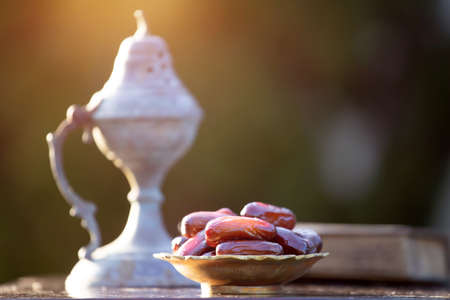 Festive greeting card for Muslim holy month Ramadan Kareem with dates, Quaran and censerの写真素材