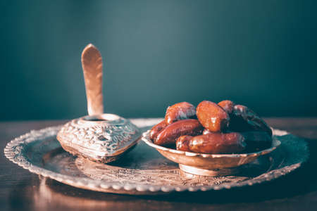 Festive greeting card for Muslim holy month Ramadan Kareem with dates, Quaran and censerの写真素材