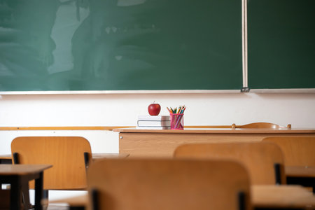 Back to School Concept. Accessories and books against chalkboard.の写真素材