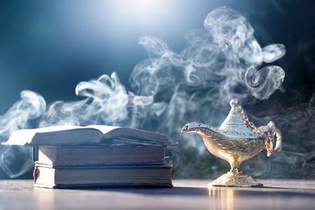 Ramadan Kareem festive greeting card for Muslim holy month with Aladdin lamp of wishes and Quranの写真素材