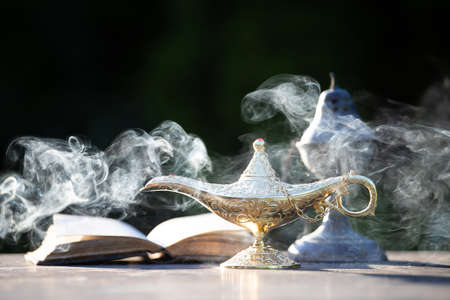 Ramadan Kareem festive greeting card for Muslim holy month with Aladdin lamp of wishes and Quranの写真素材